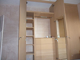 A cupboard with compartments built inside it